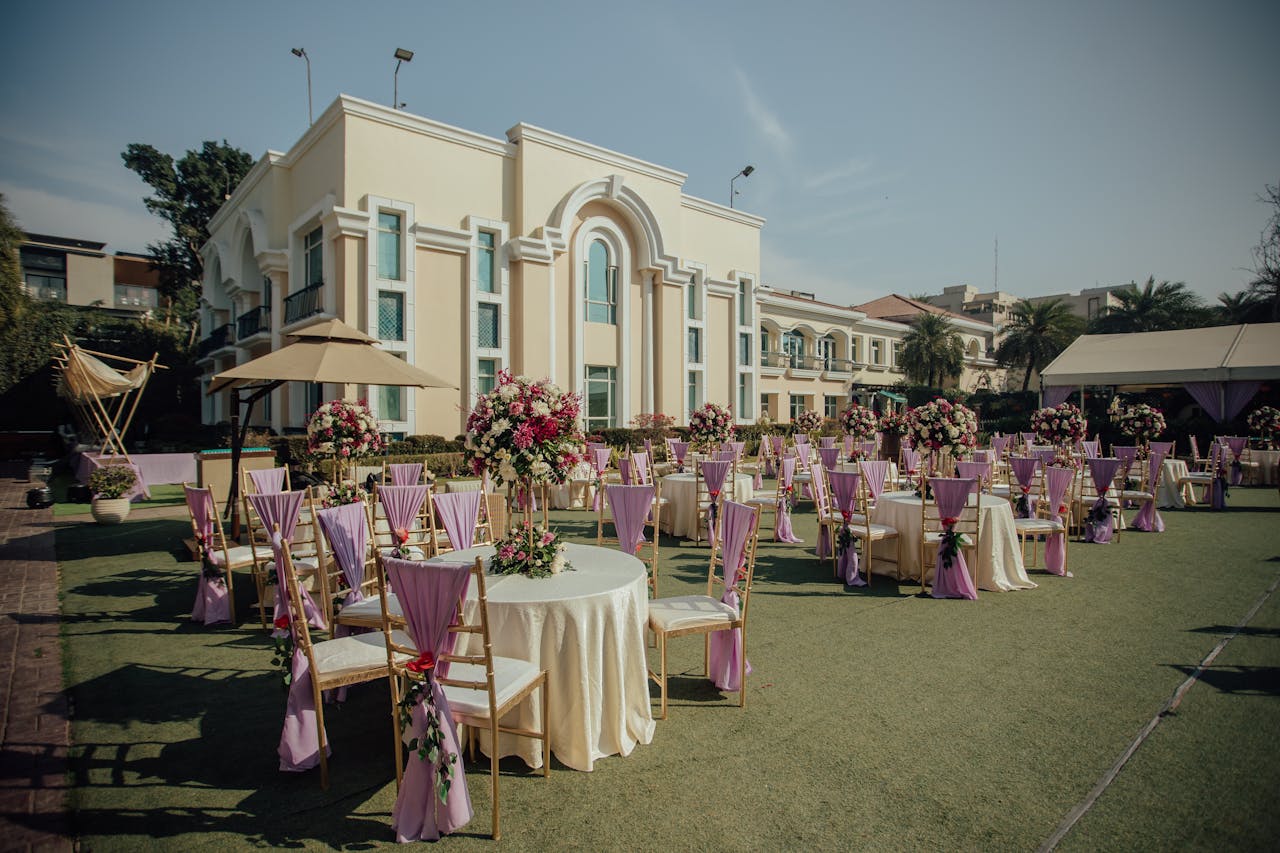 Stylish outdoor wedding reception with floral decor and seating arrangements.